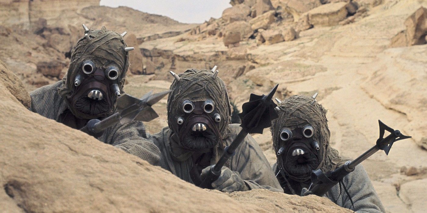 A Star Wars: New Hope still shows three Tusken Raiders hid behind sand on Tatooine