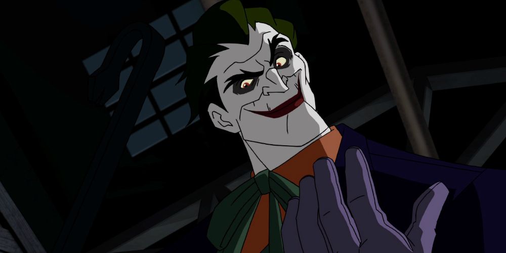 Joker from Under The Red Hood smiling down at the camera