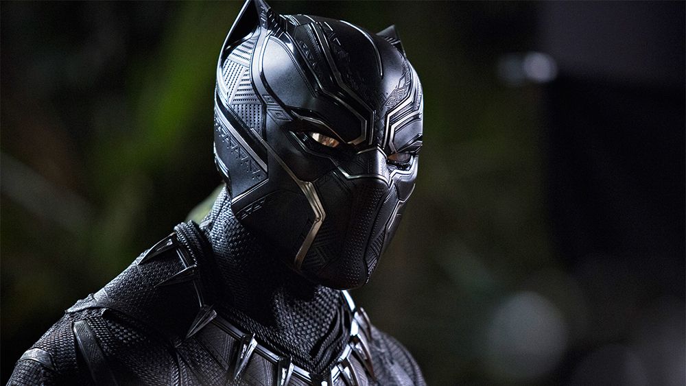 A close-up on Black Panther's costume as seen in the MCU, with a blurred out green backdrop