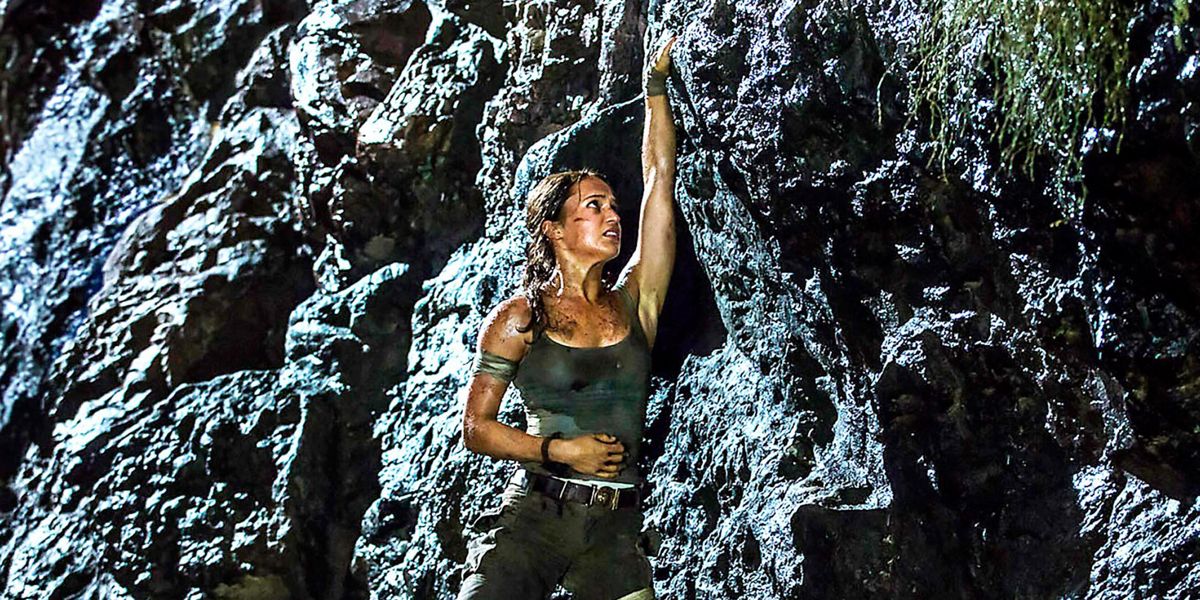 Alicia Vikander's Lara Croft hangs off a mountain in 2018's Tomb Raider