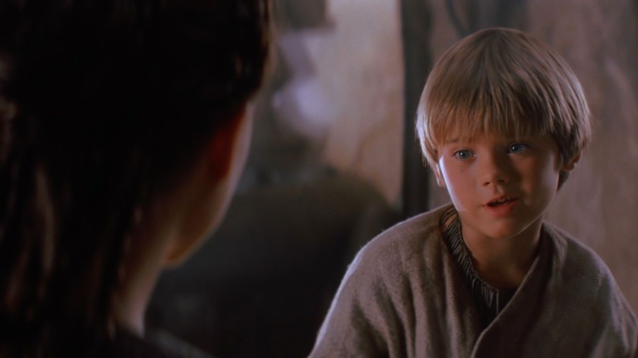 Young Anakin Skywalker talking to Padme