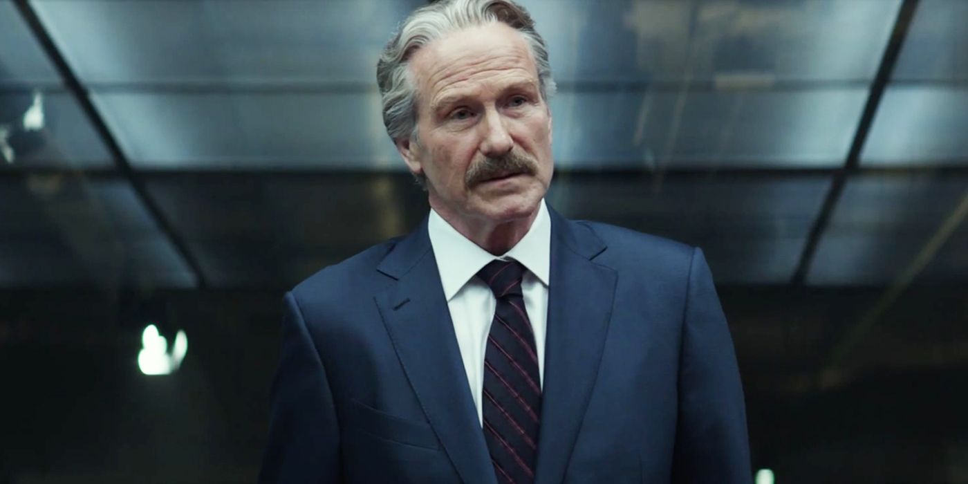 William Hurt as General Thunderbolt Ross in a dark gray room in Captain America: Civil War.