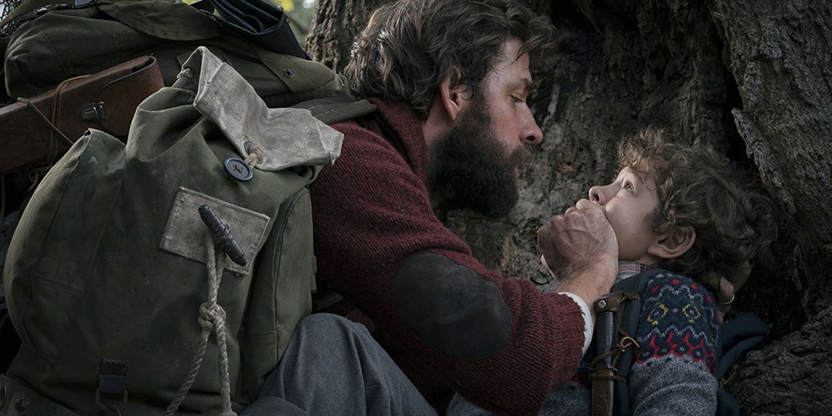 John Krasinski's character keeps his child quiet in A Quiet Place