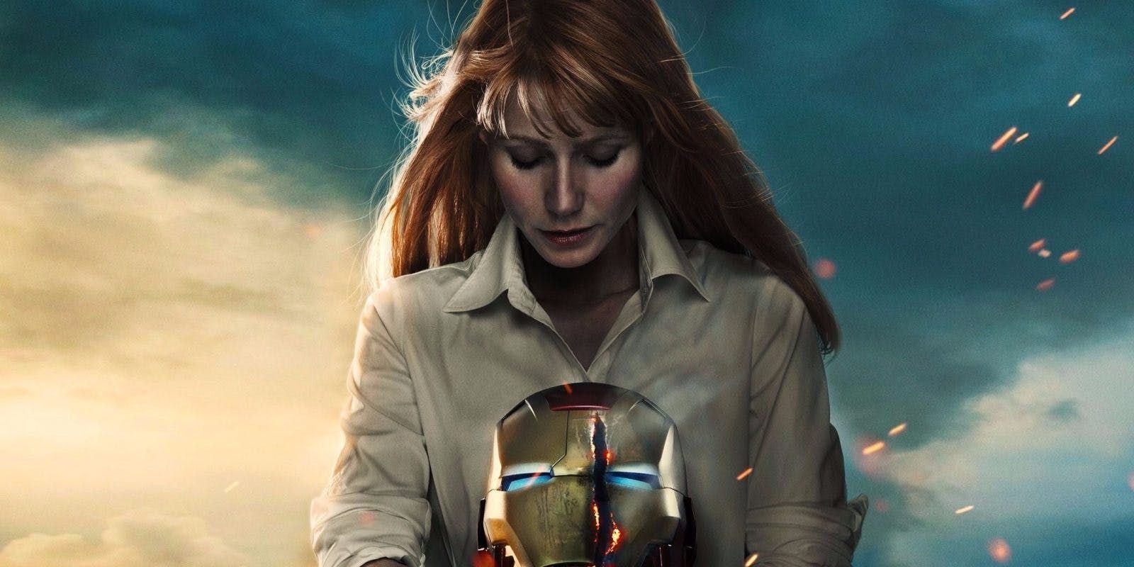 Pepper Potts holding the Iron Man helmet in Iron Man 3