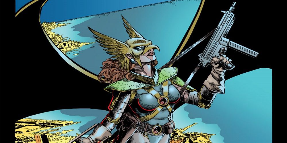 Hawkwoman holding an assault rifle in DC Comics.