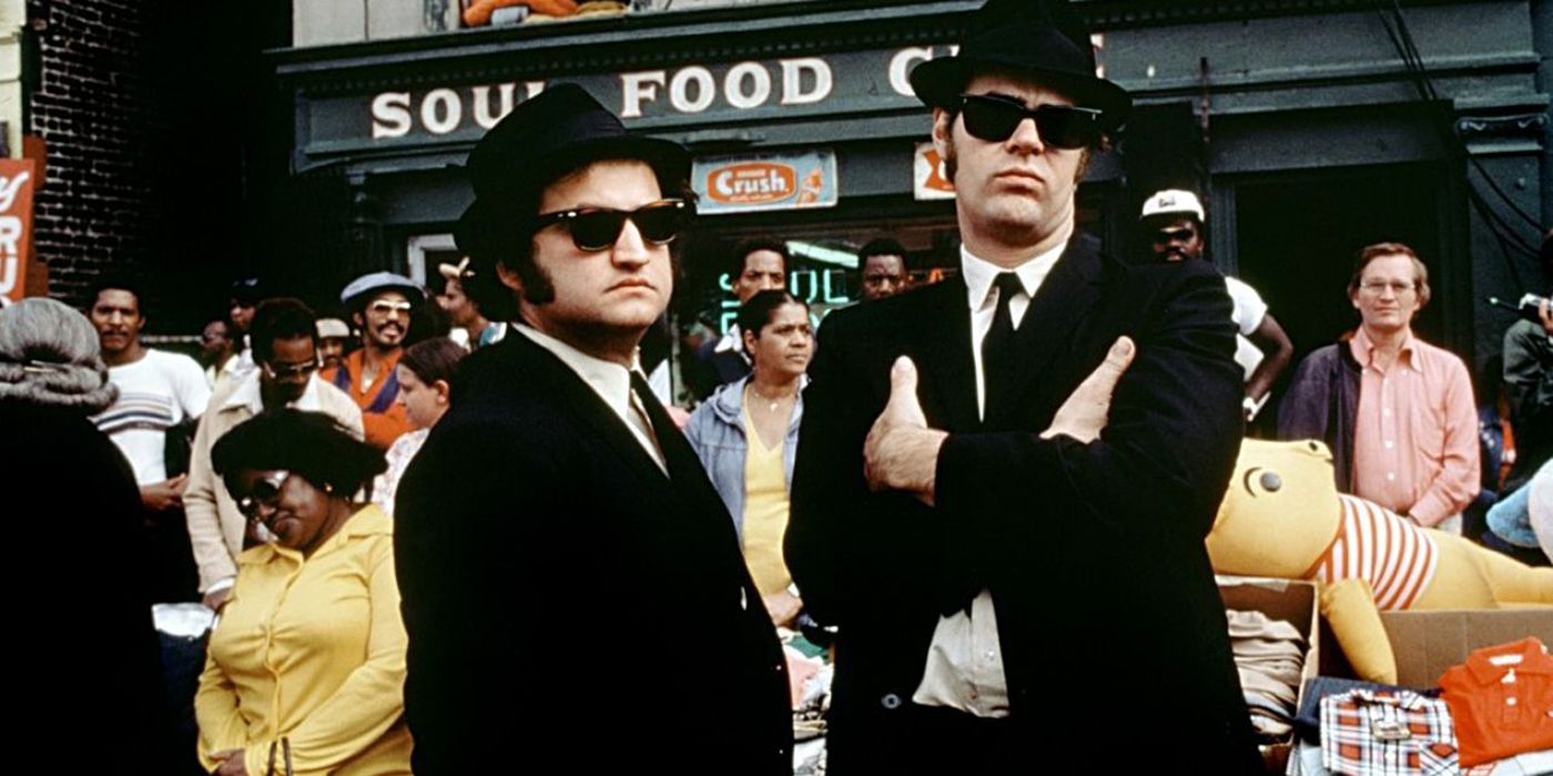 the blues brothers with the cast in the background