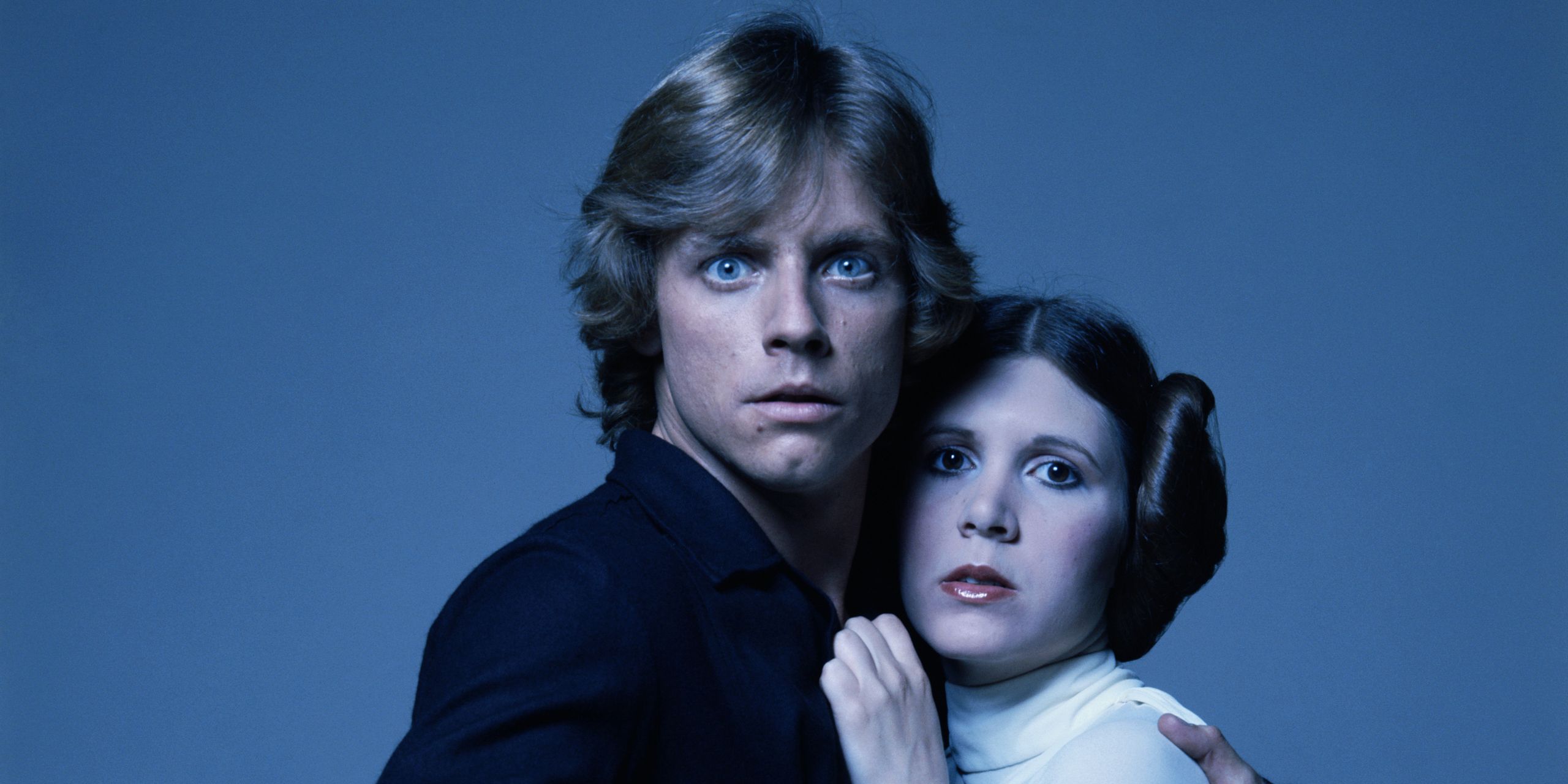 Luke and Leia holding each other in the Star Wars franchise