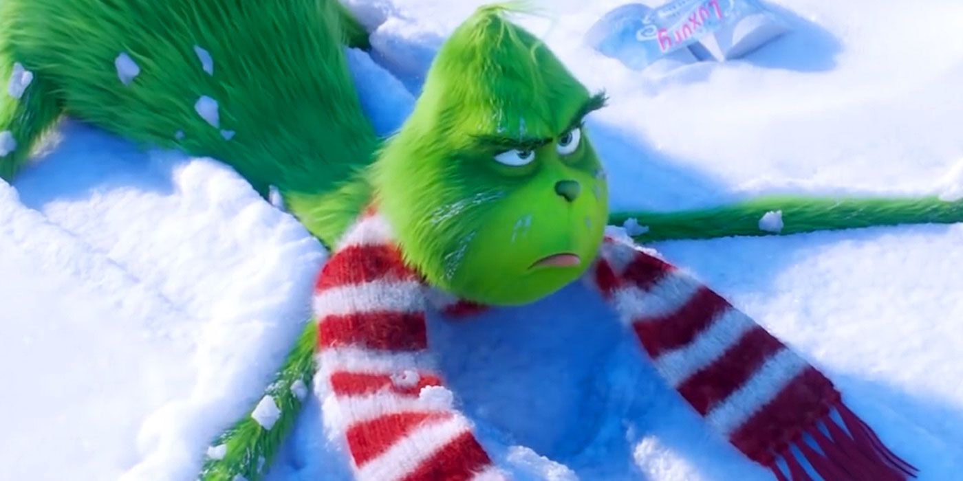 the grinch looking annoyed wearing a scarf