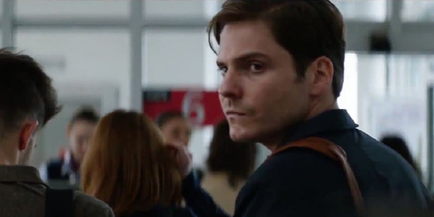 Zemo looking over his shoulder in a crowded room