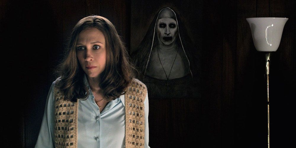 Lorraine Warren stands in front of the Nun painting in The Conjuring 2