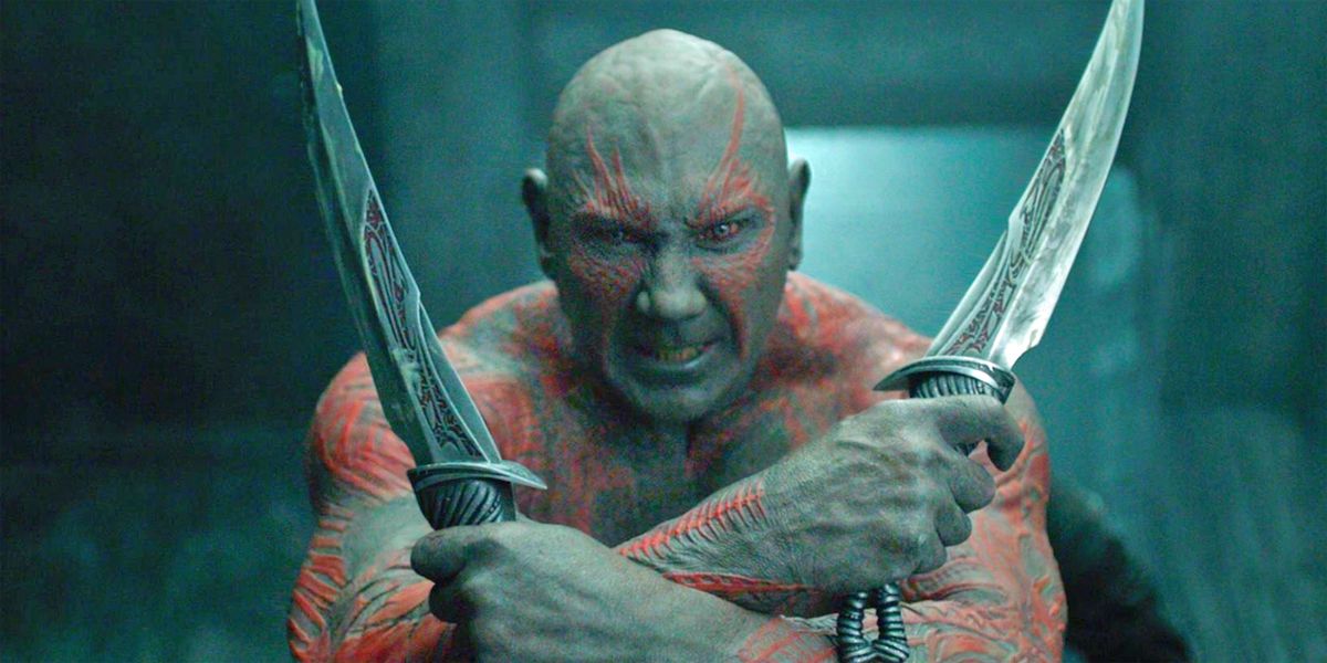 Dave Bautista hold weapons as he prepares for battle in Guardians of the Galaxy