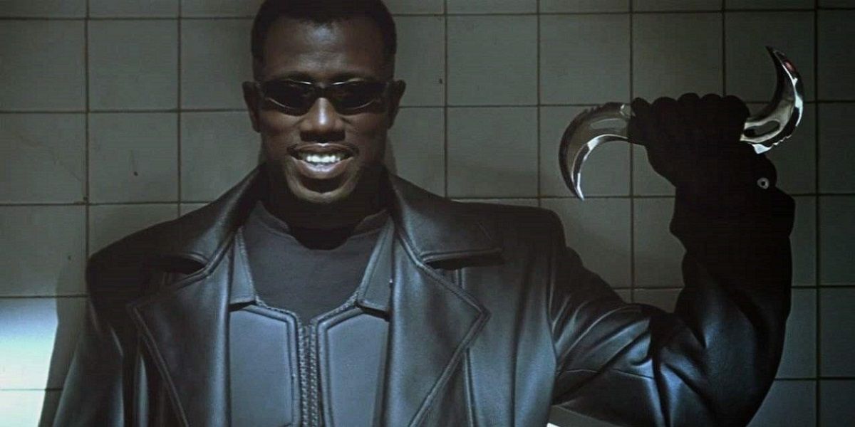 Blade smiling and holding a shuriken.