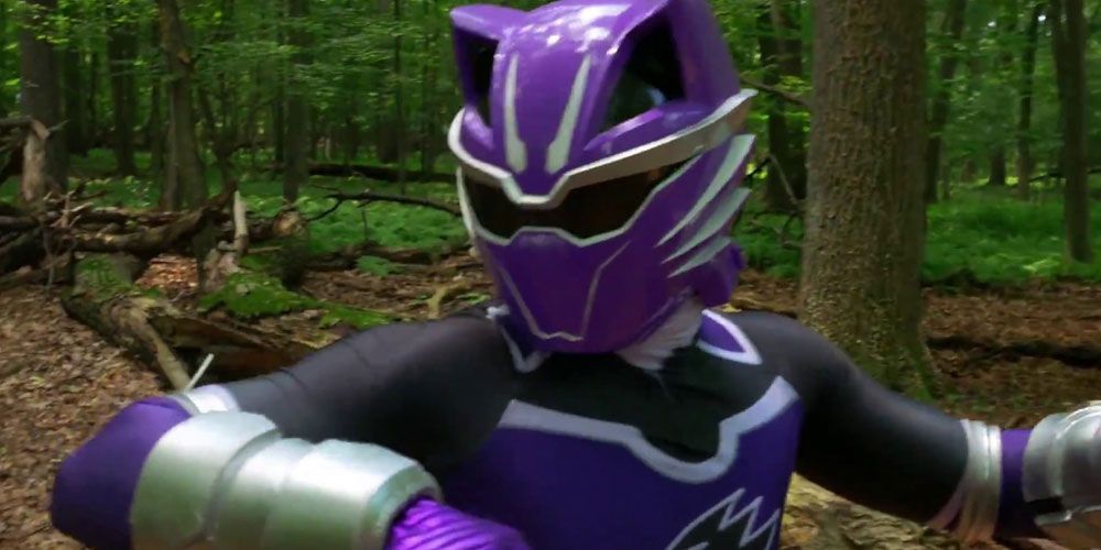 The Wolf Jungle Fury Power Ranger, Robert James, prepares to attack in the woods