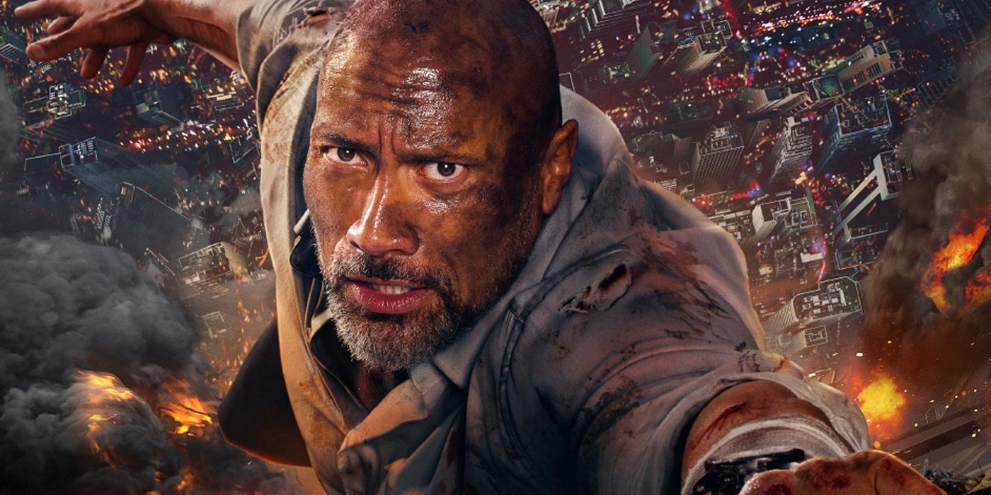 Dwayne Johnson hanging from a building in Skyscraper