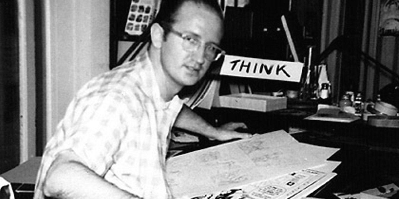 Steve Ditko sits at his Marvel drawing table