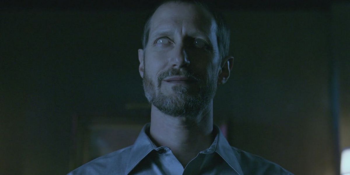 Alastair smiling creepily from Supernatural