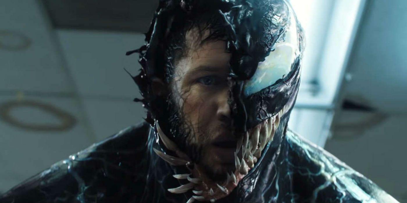 Venom removes half his face to reveal Eddie Brock (Tom Hardy) underneath