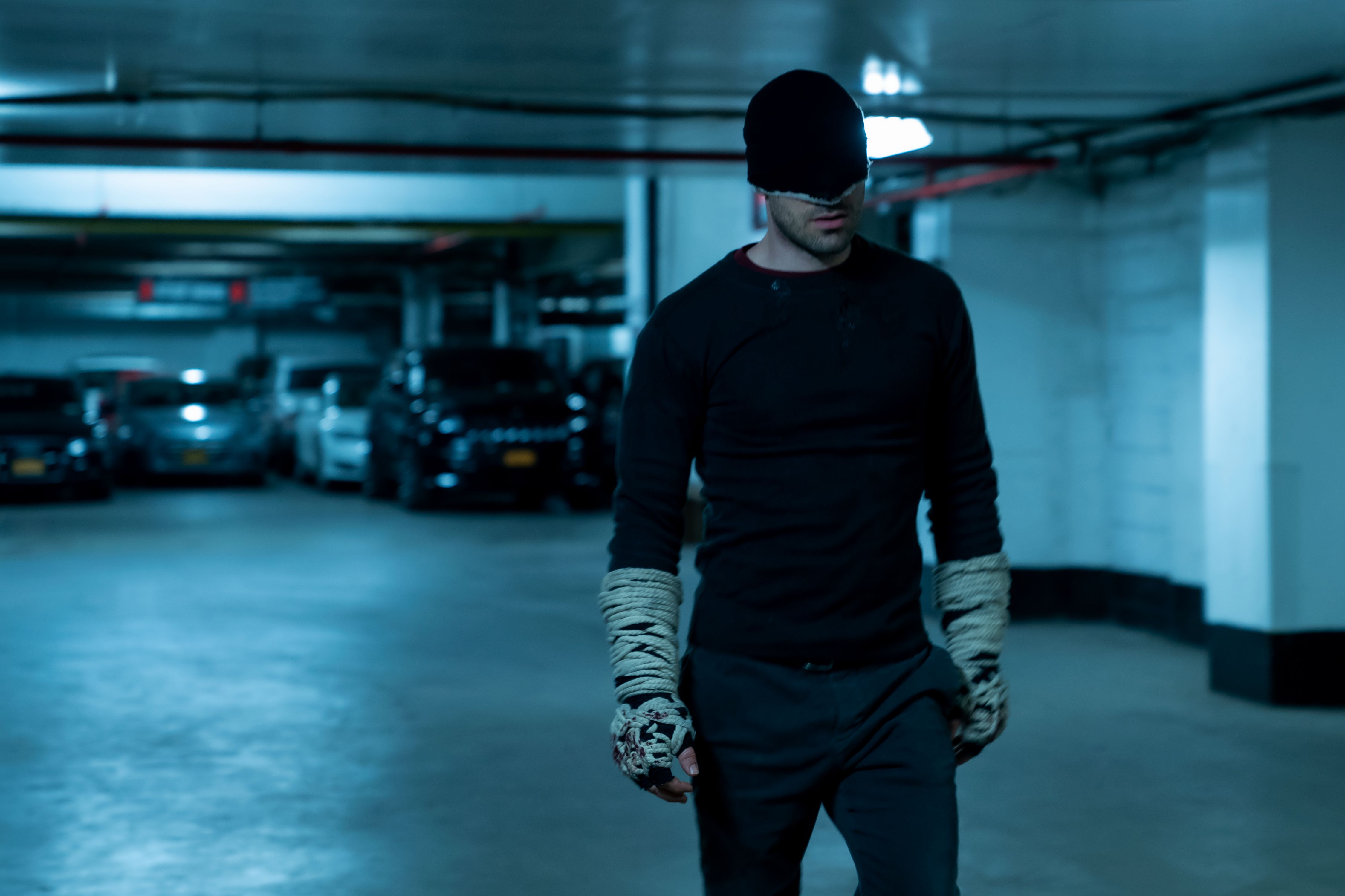 Daredevil wraps ropes around his knuckles in Season 3 photo.