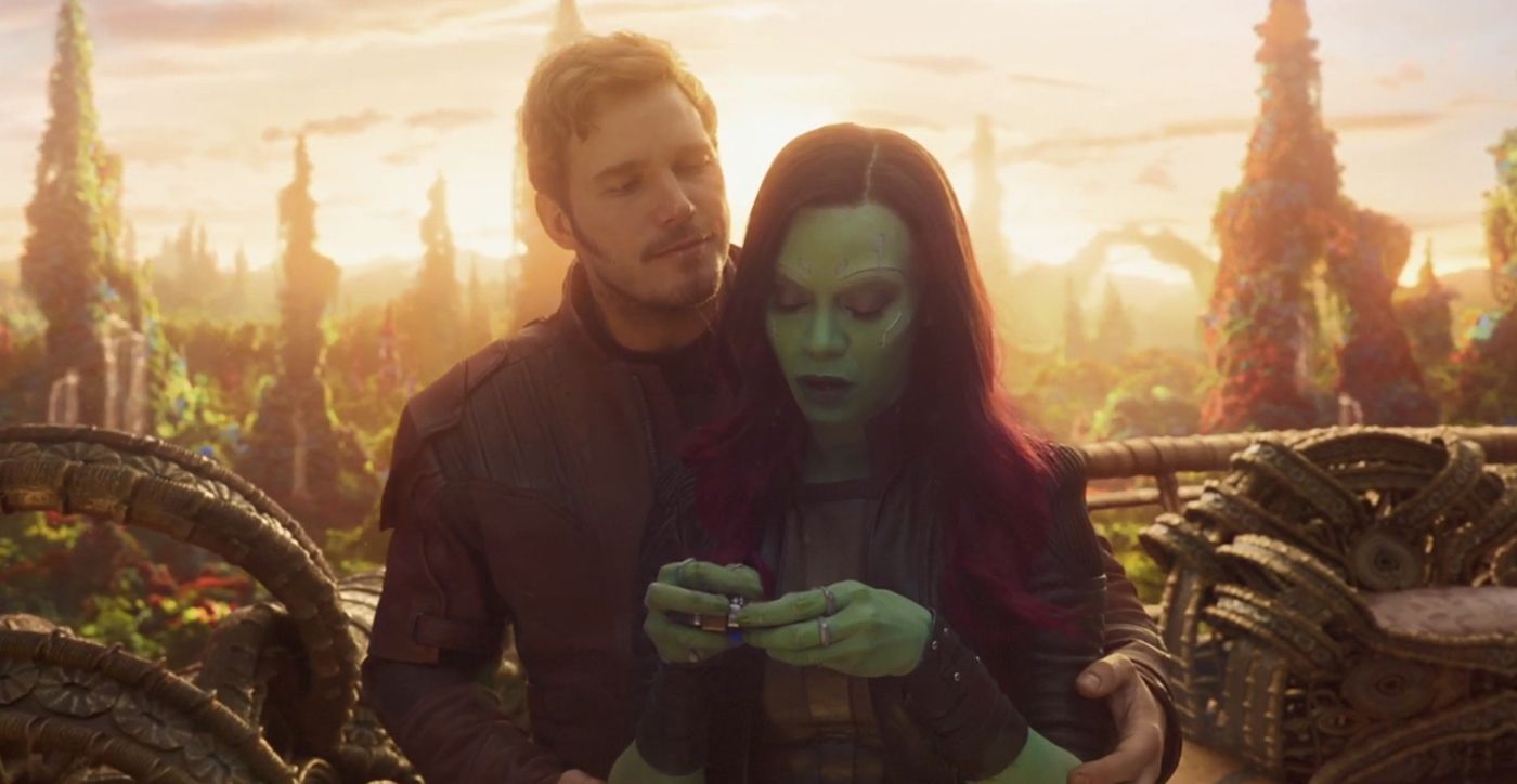 Star-Lord holds Gamora from behind 