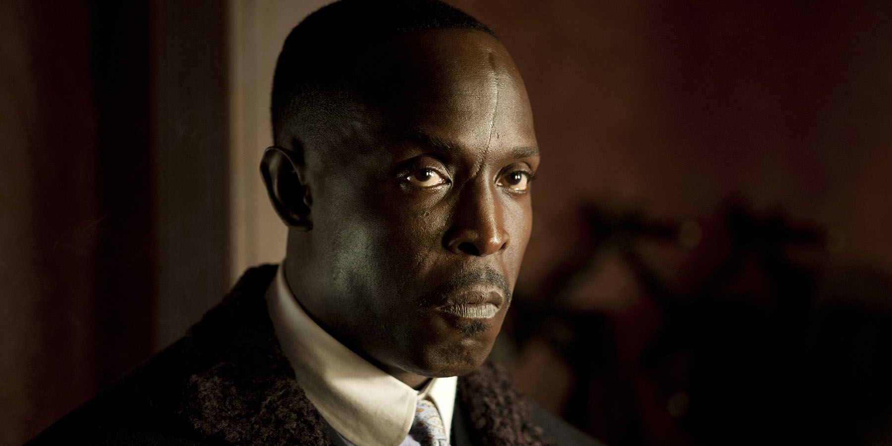Michael K. Williams stares ahead during a scene