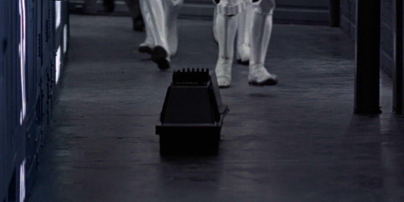 MSE-6 droid or Mouse Droid guiding stormtroopers through a hallway in A New Hope