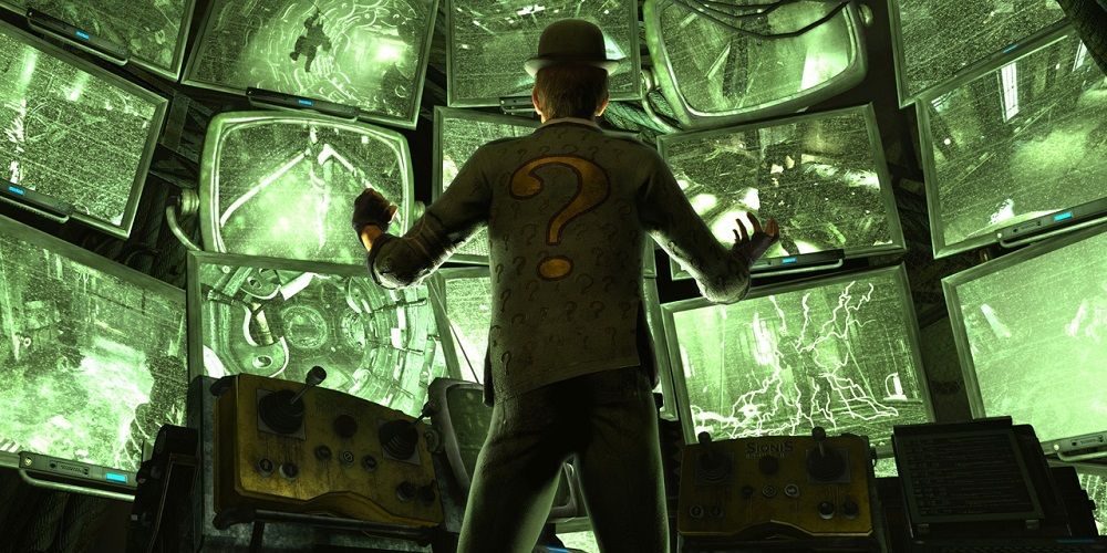 OThe Riddler watching death traps on monitors in Batman: Arkham City video game