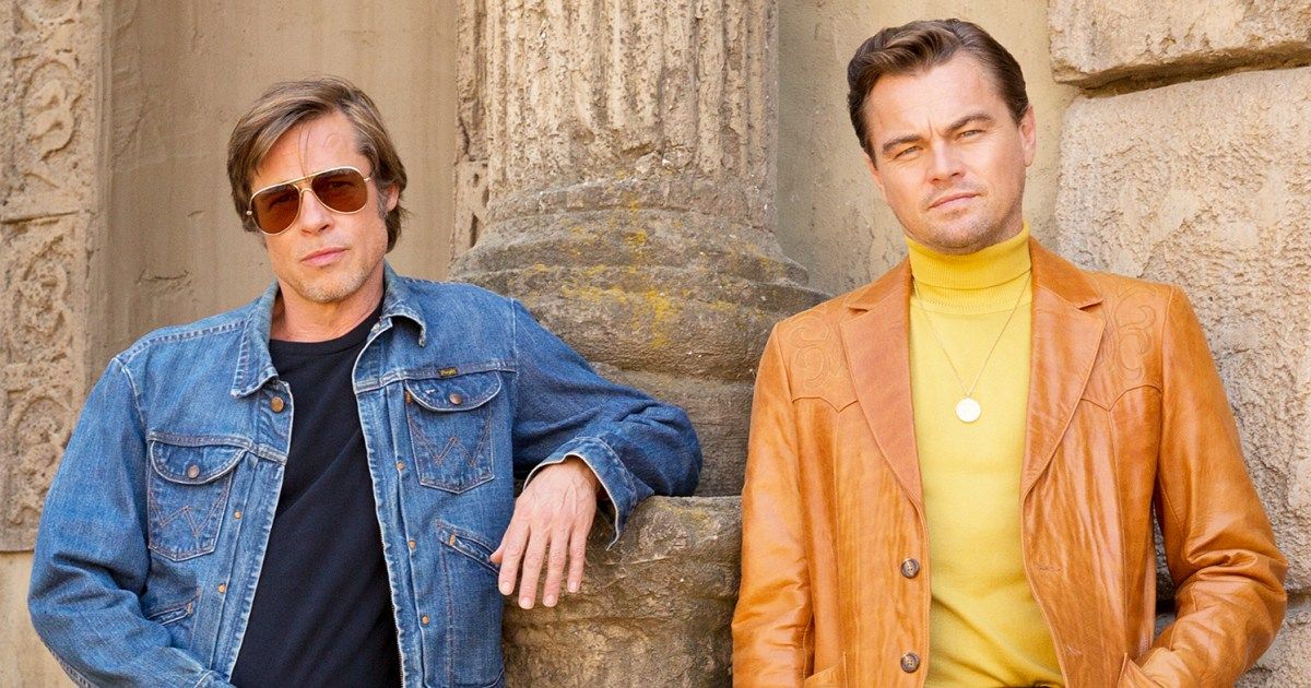 Brad Pitt and Leo DiCaprio stand side-by-side in Once Upon a Time in Hollywood