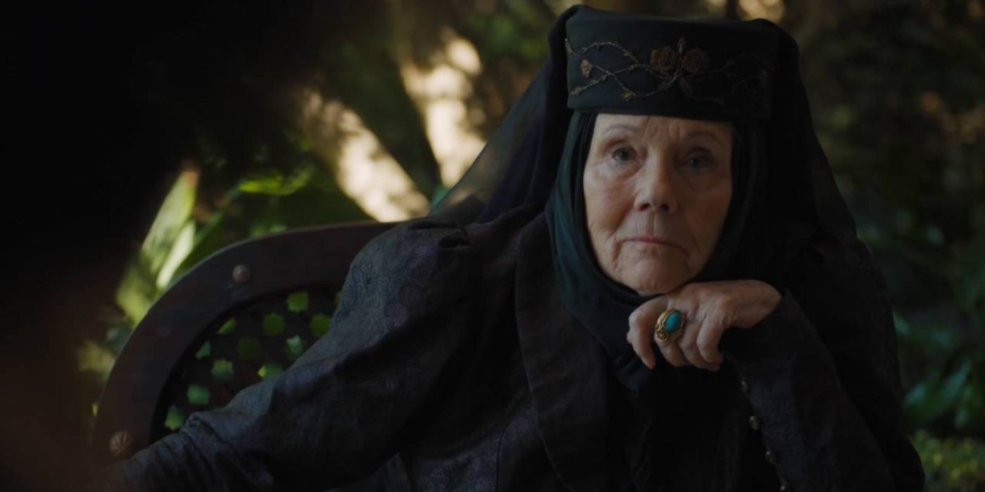 Olenna Tyrell (Diana Rigg) looking calm with her hand against her chin