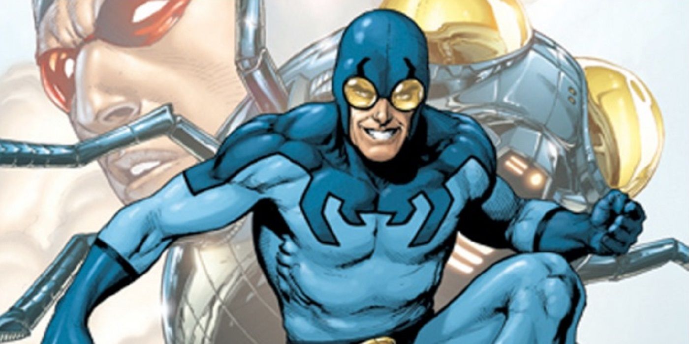 Ted Kord as Blue Beetle in DC Comics grinning and ready to fight.