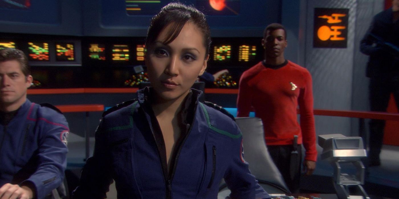 Sato from the Mirror Universe sitting in a chair in Star Trek.