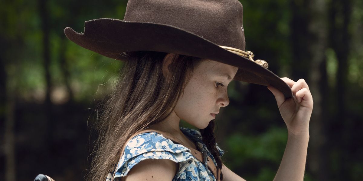 Judith (Cailey Fleming) holding her father's hat in The Walking Dead Season 9