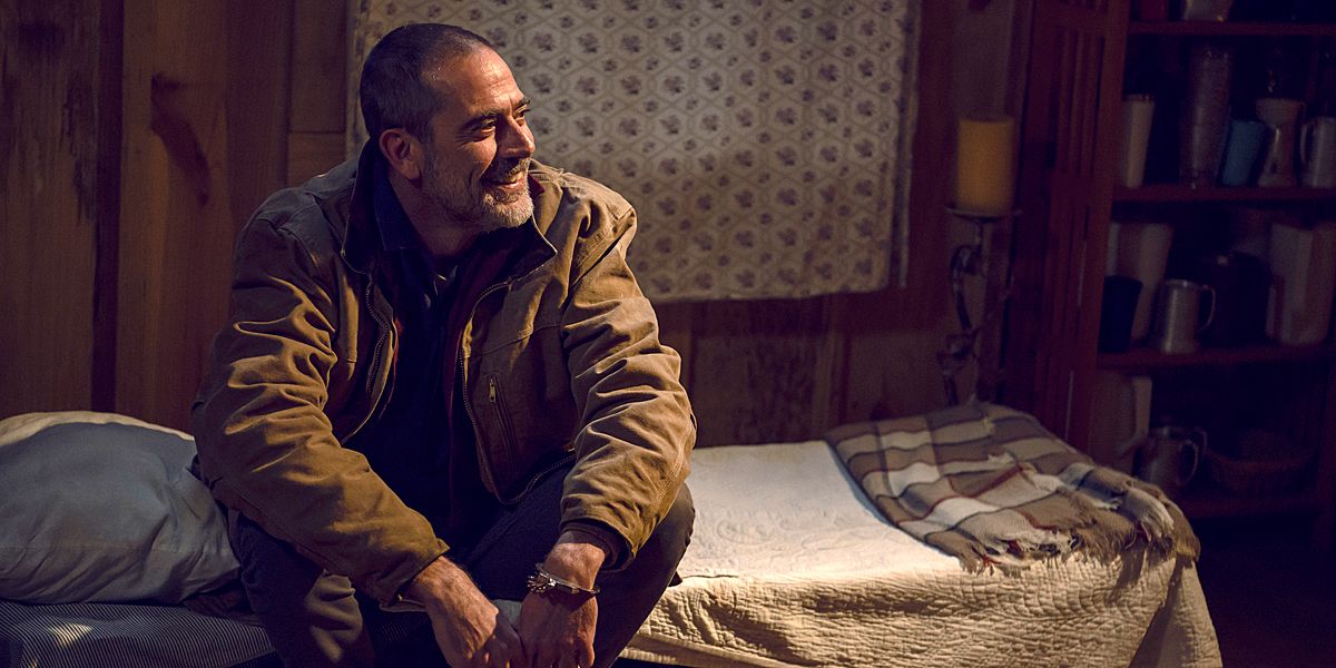 The Walking Dead Negan sitting on a bed