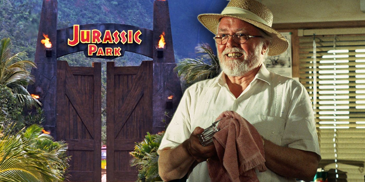 John Hammond stands in front of the Jurassic Park gates cleaning a glass