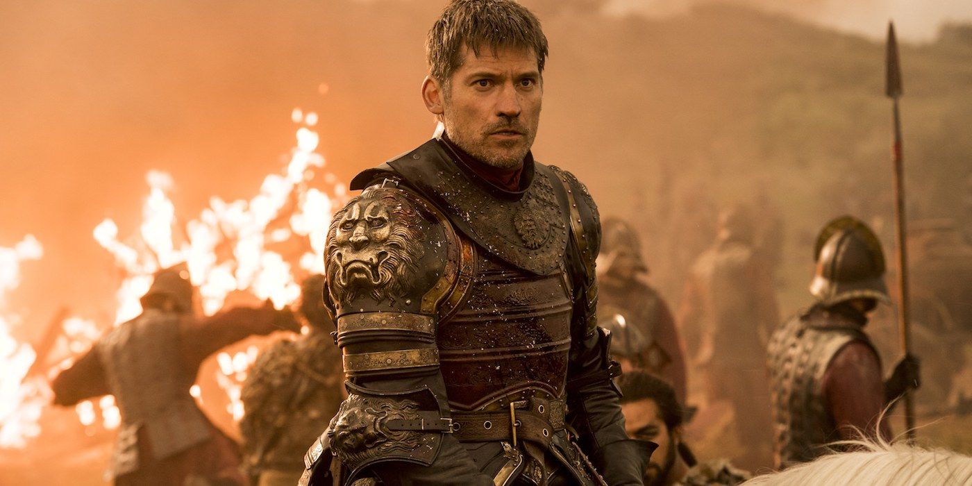 Jaime Lannister marches through the flames as Lannister soldiers burn behind him