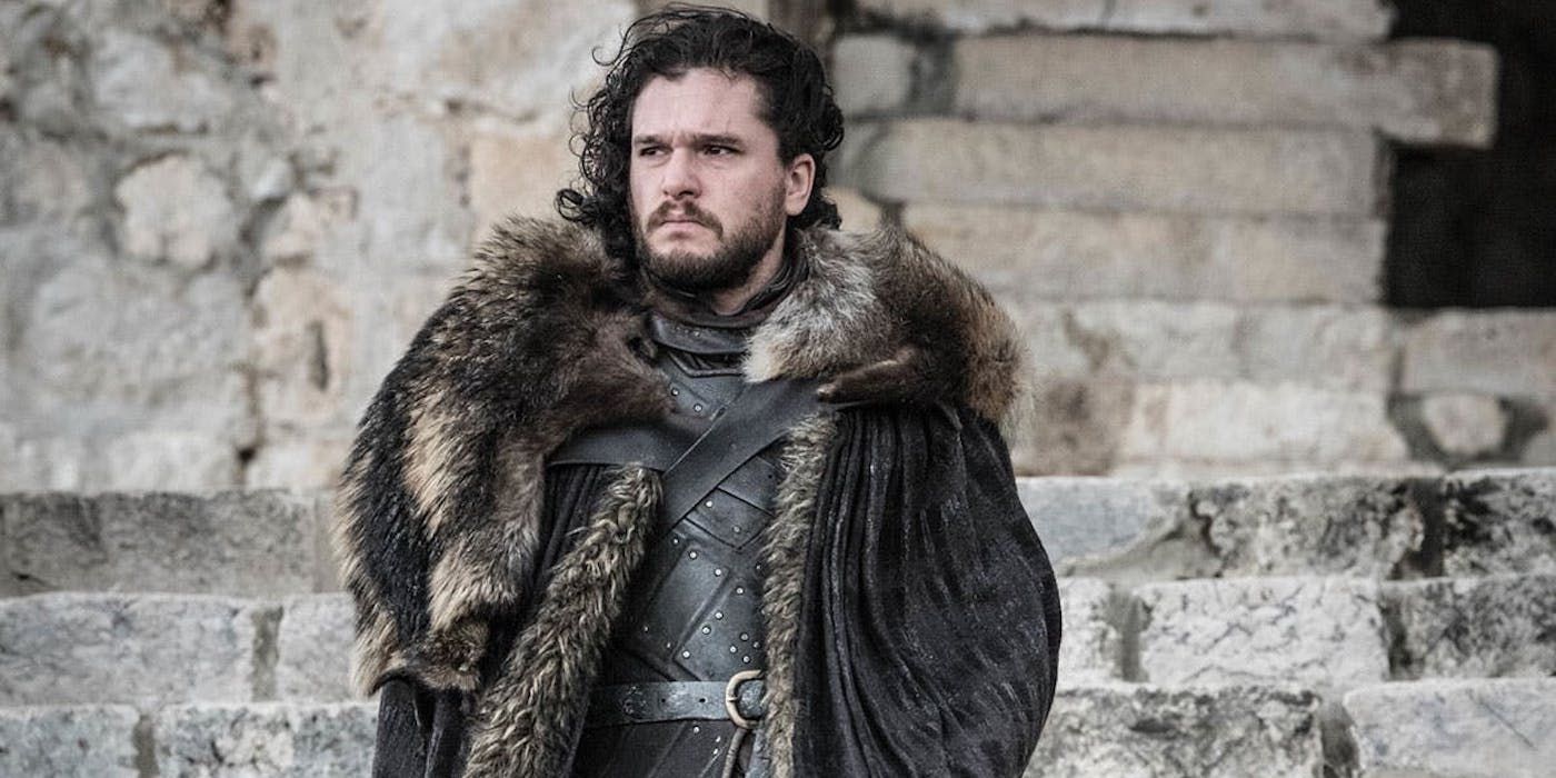 Jon Snow looking serious while standing on stone steps