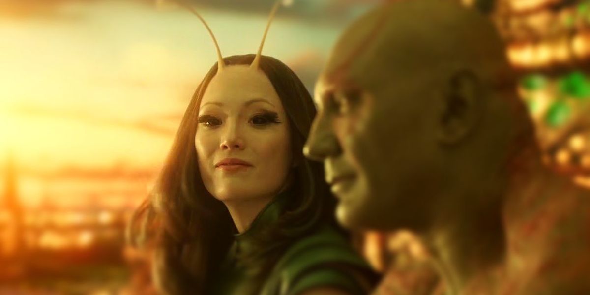 Mantis looks at Drax, who is in profile