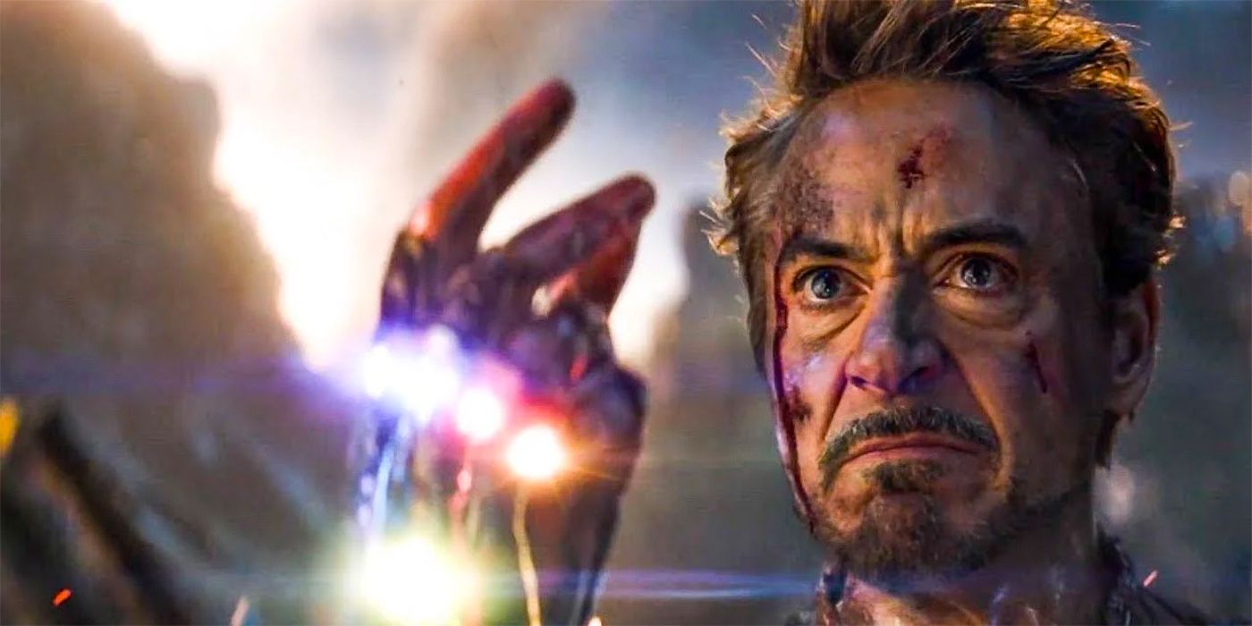 Tony Stark snaps his fingers wearing an Infinity Gauntlet