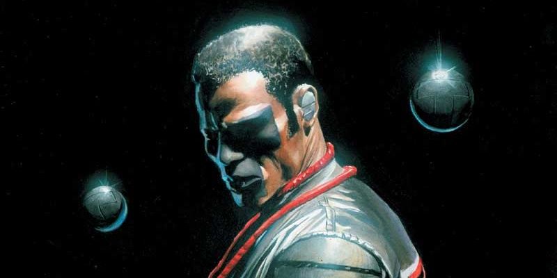 Mr. Terrific making a somber expression while standing in the dark in DC Comics