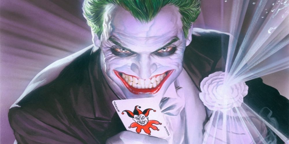 The Joker shoots acid from his flower lapel