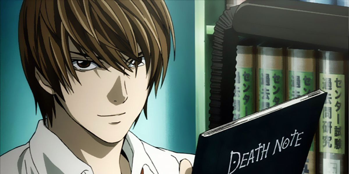 Light Yagami/Kira holding the Death Note and smiling in the Death Note anime