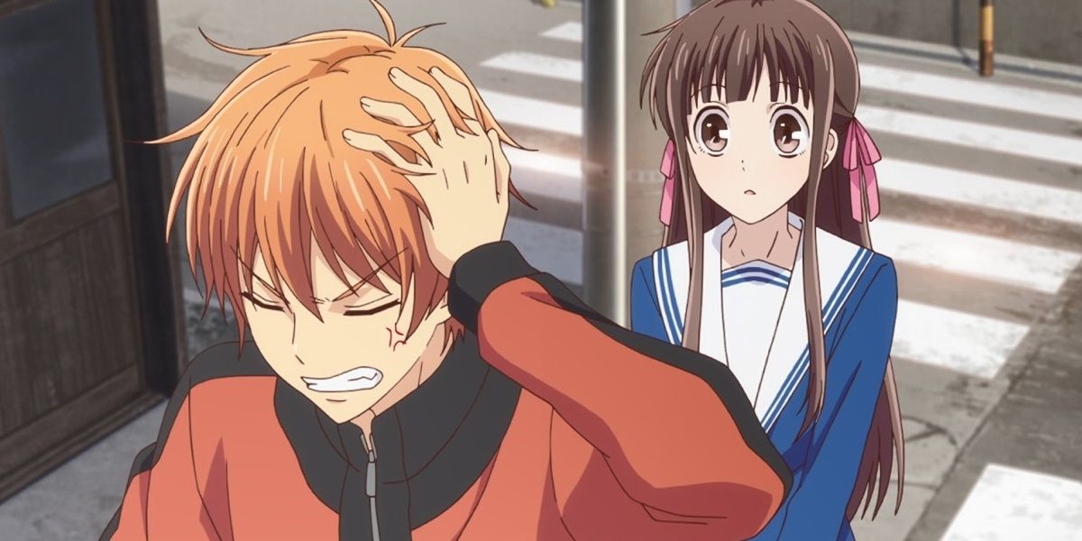 Kyo frustrated and Tohru looking concerned in Fruits Basket.