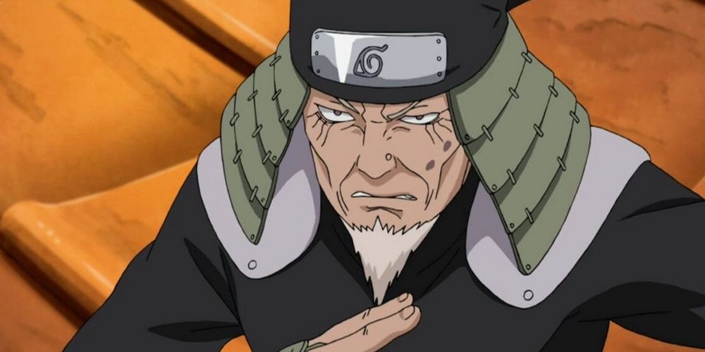 Hiruzen with a serious look as he squares off against Orochimaru in Naruto.