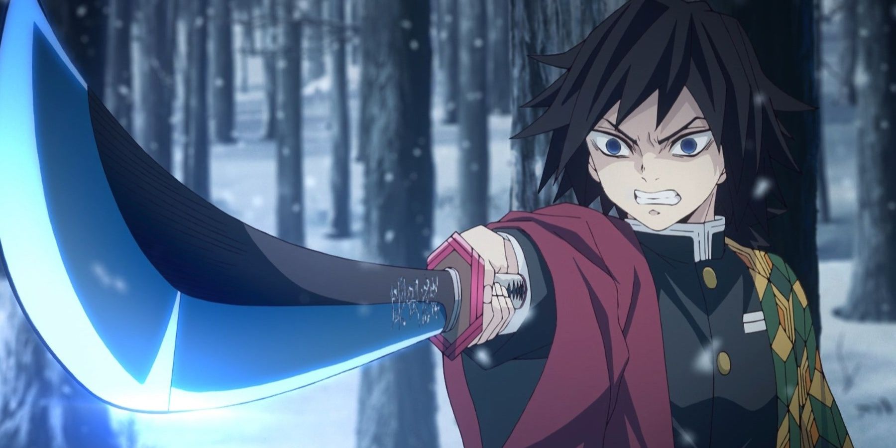 Giyu Tomioka the Water Hashira holding his blade in the snow in Demon Slayer.