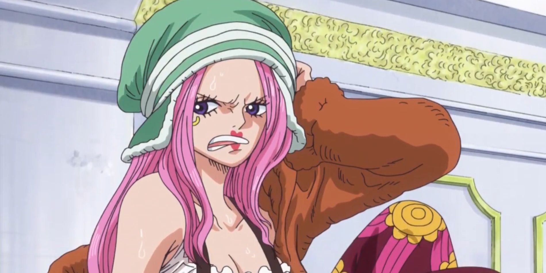 Jewellry Bonney looking irritated and clutching the side of her head in One Piece.