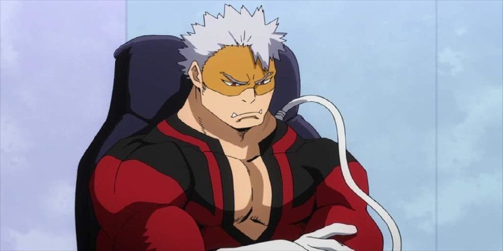 Vlad King scowling and crossing his arms while sitting in a chair from My Hero Academia. 