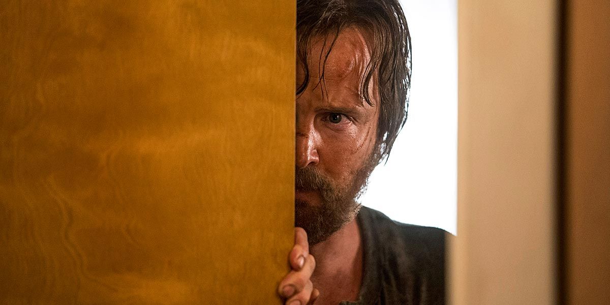 Sweating and dirty, Jesse Pinkman peeks around a door in El Camino.