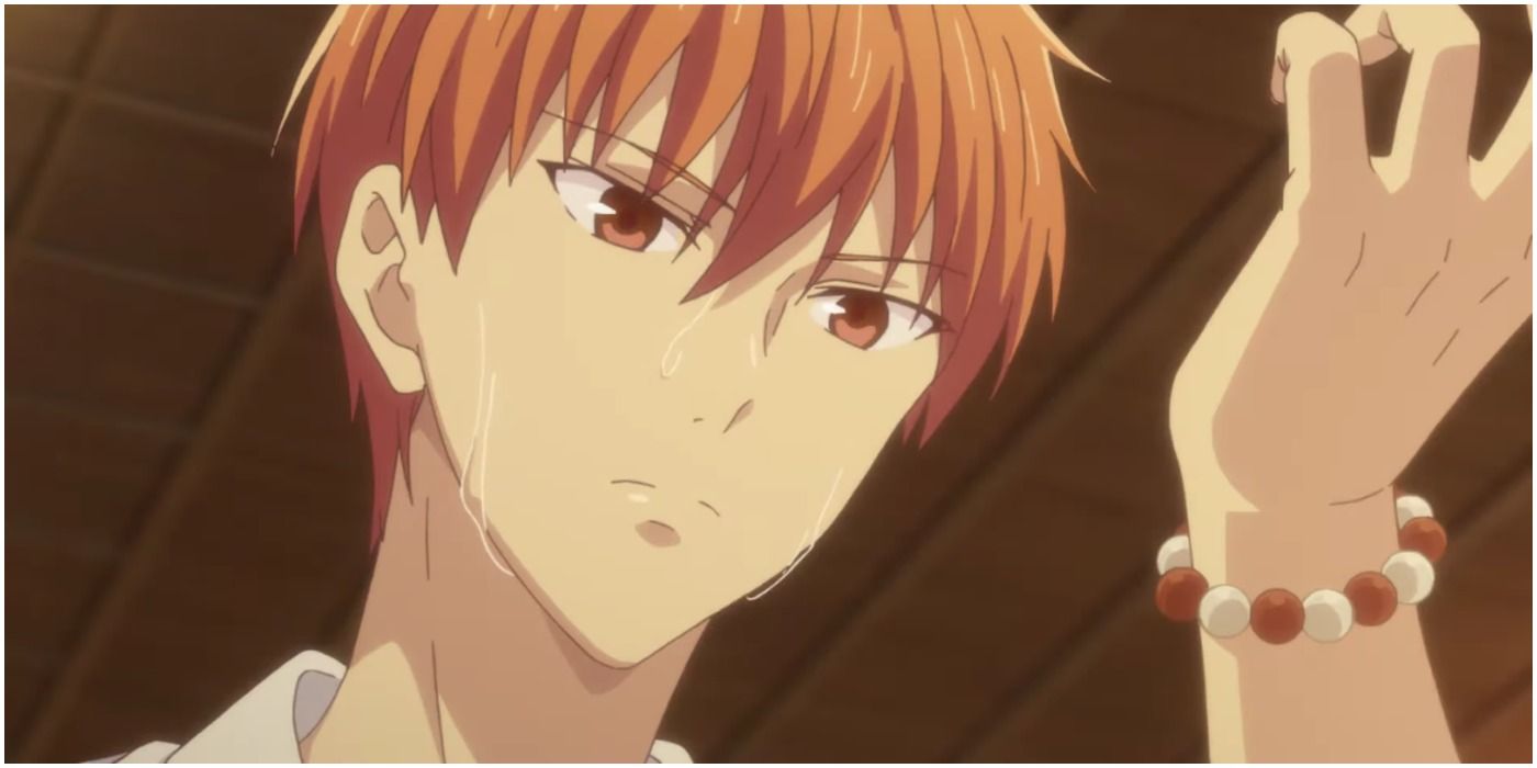 kyo sohma looking at his beads in fruits basket