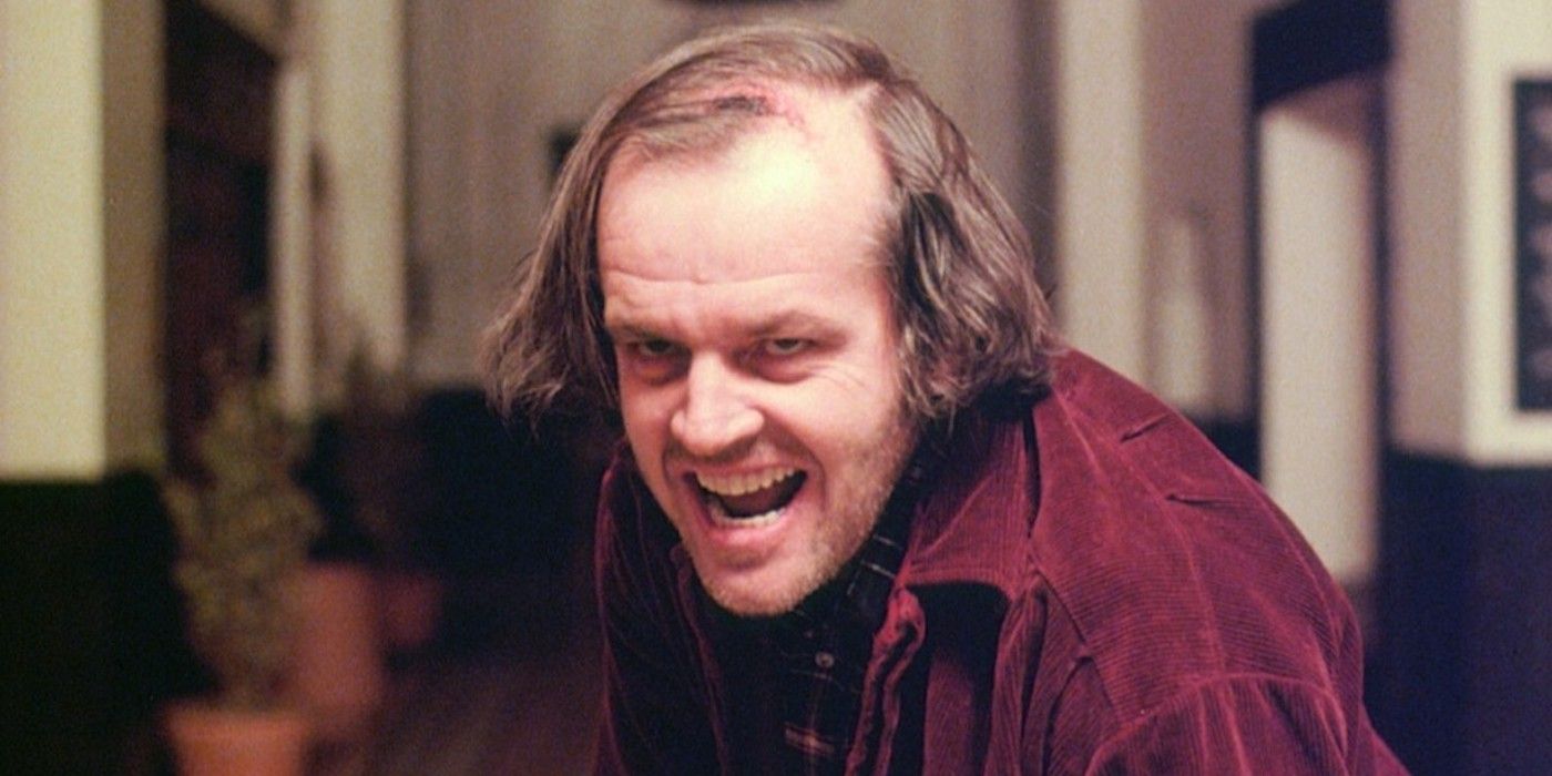 Jack Nicholson's The Shining character has a sinister grin while in a hotel corridor
