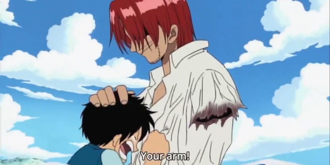 Monkey D. Luffy consoles Shanks after the latter loses his arm during the first arc of One Piece