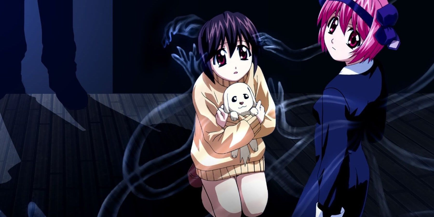 Elfin Lied's Mayu clutching a puppy on her knees with Lucy looking back over her shoulder.